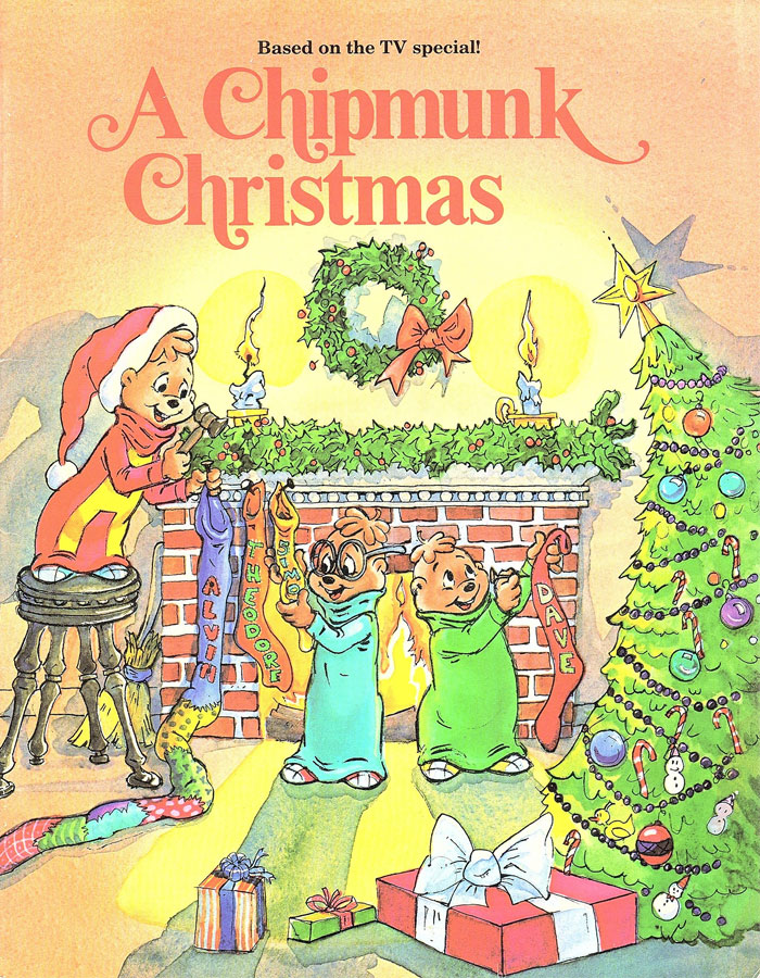 Illustrated scene from "A Chipmunk Christmas" showing chipmunks by a decorated fireplace and tree.