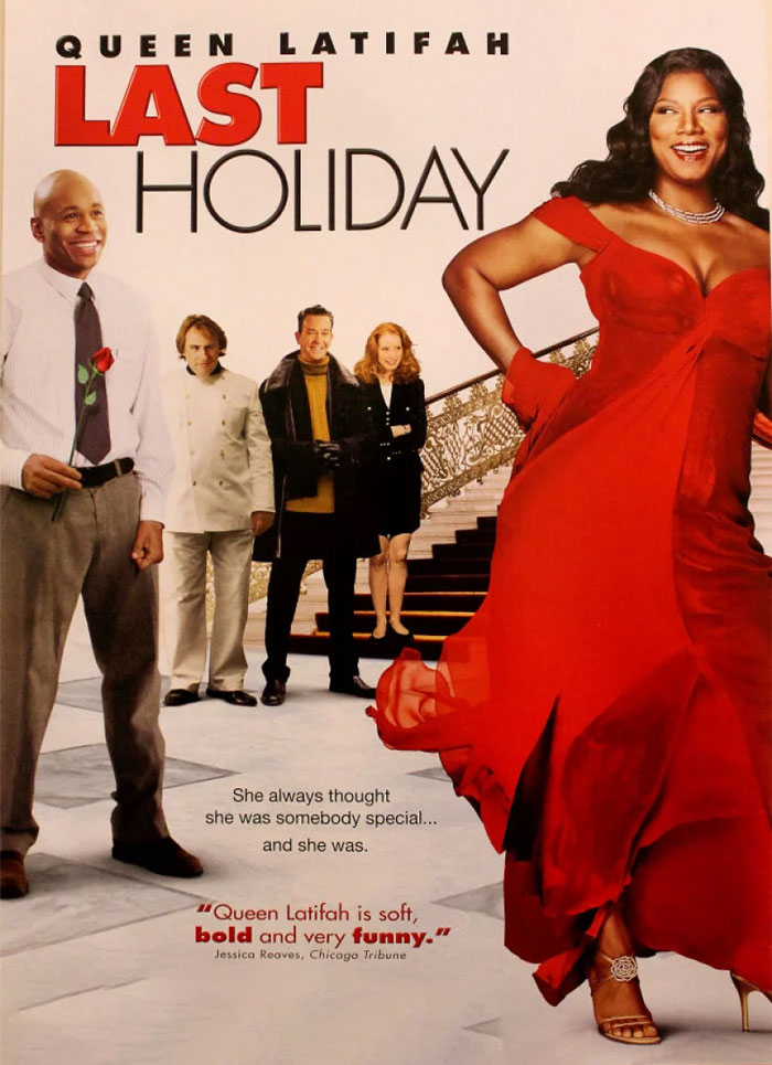 Queen Latifah in a red dress on "Last Holiday" movie poster, one of the best Christmas movies to enjoy during the holidays.