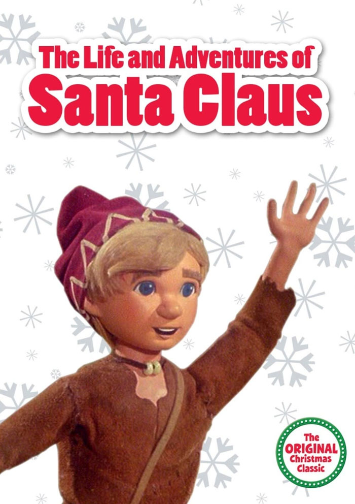 Cover of "The Life and Adventures of Santa Claus" Christmas movie with a joyful character.