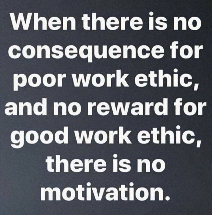 Work-related meme with white text on black background about no consequence for poor work ethic and lack of motivation.