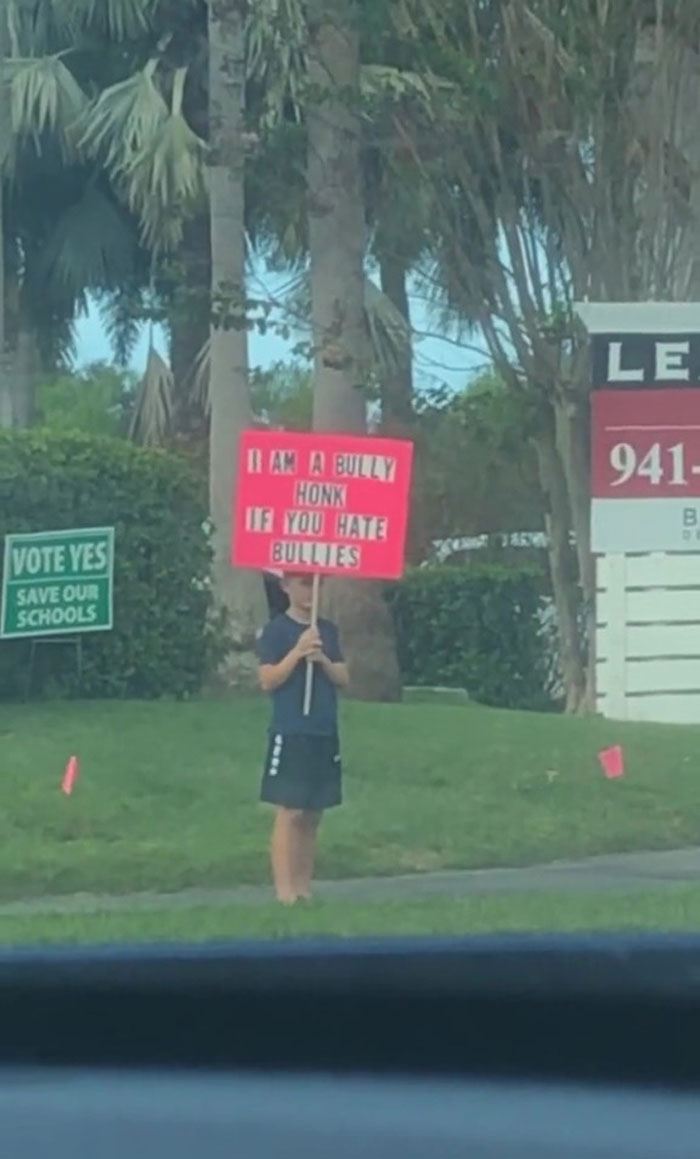 Parents Spark Debate After Making Their Son Stand Outdoors With A Sign &lsquo;I Am A Bully&rsquo; As A Punishment