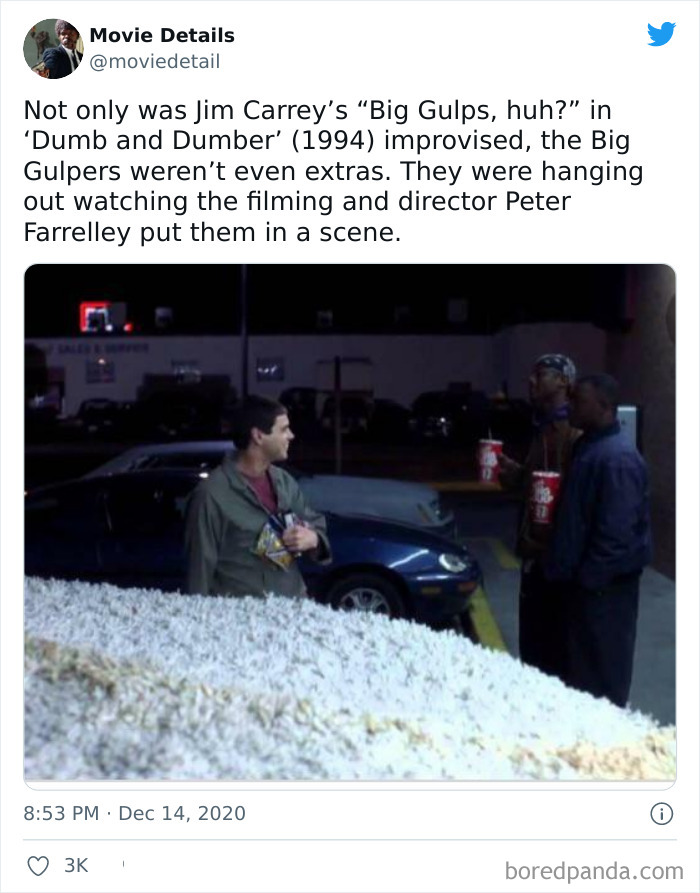 Scene from Dumb and Dumber showing obscure movie Easter eggs with actors holding popcorn at night by parked cars.