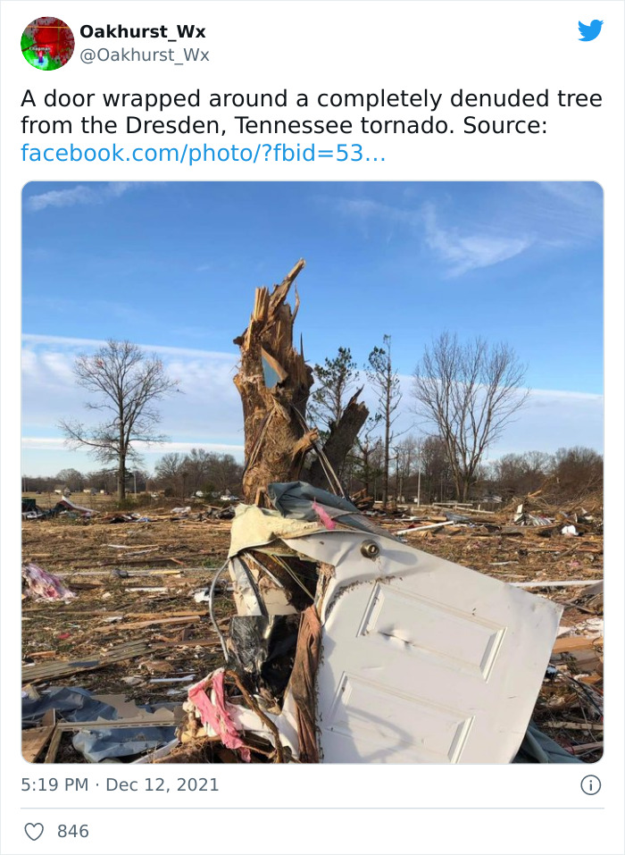 Door wrapped around tree in Mayfield tornado aftermath, showing severe damage and debris scattered across the landscape. Door wrapped around tree in Mayfield tornado aftermath, showing severe damage and debris scattered across the landscape.