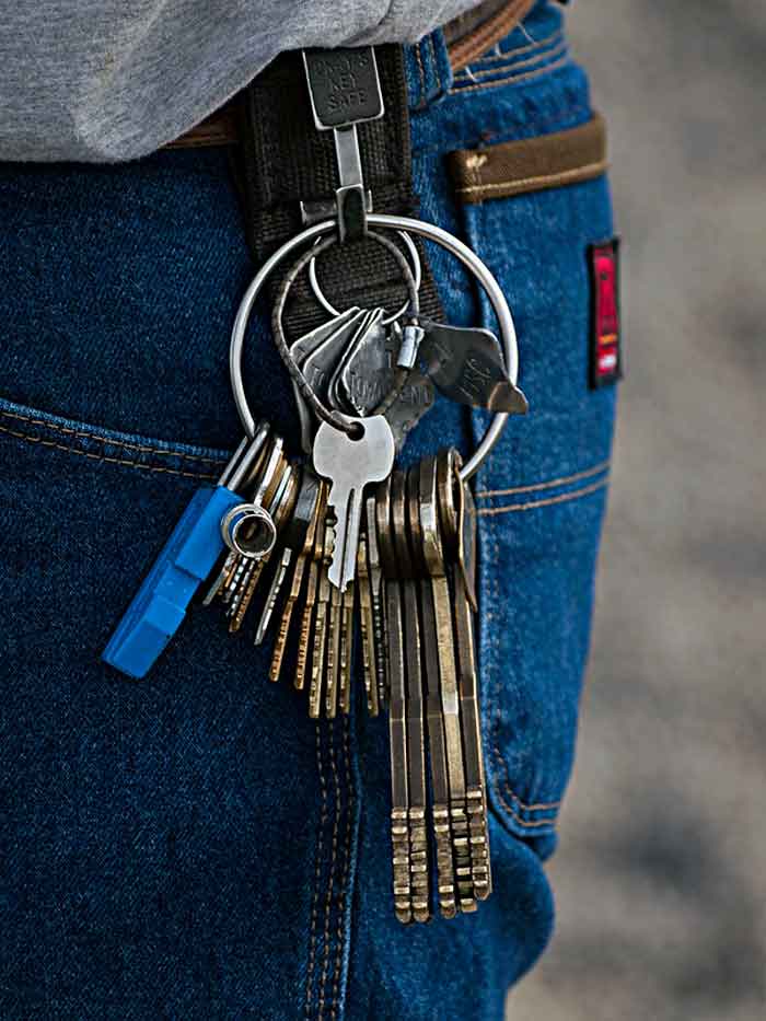 Close-up of a person’s belt with multiple keys, symbolizing insights from former prisoners about incarceration experiences.