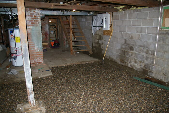 Basement under construction with gravel floor and exposed beams, illustrating a moment lawyers in this online group shared.