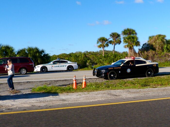Law enforcement vehicles parked by roadside as lawyers in this online group share moments people messed up big time