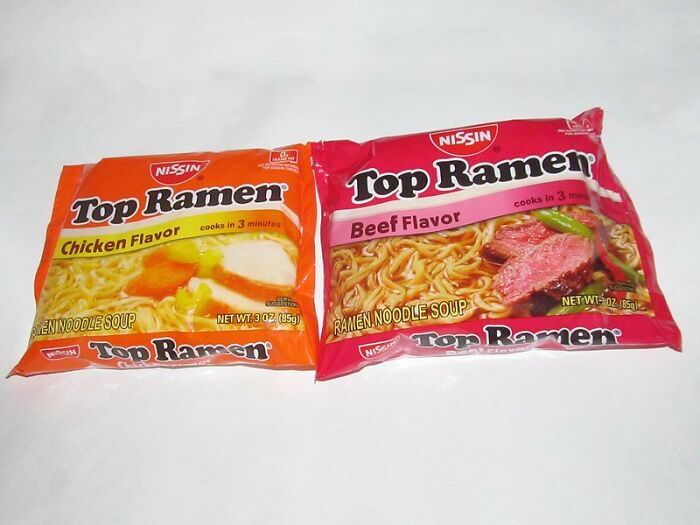 Two packets of Top Ramen chicken and beef flavor instant noodles, common prison food staple for former prisoners.