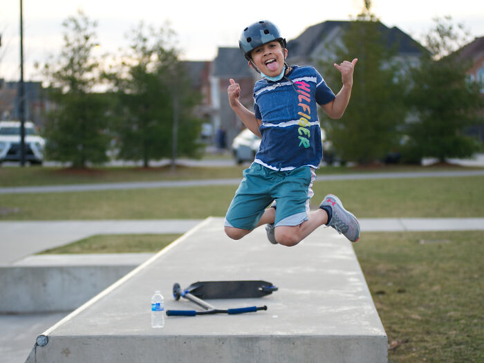 Boy wearing a helmet jumping at skatepark, symbolizing moments lawyers in online group share about big mistakes.