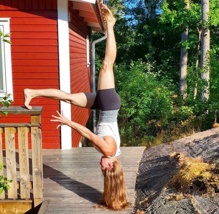 Is She Being Held Up By Her Foot Or Hair?