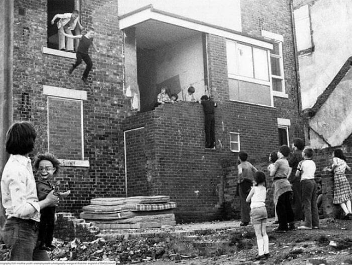 Children In Newcastle Upon Tyne’s West End Play On Piled-Up Mattresses. England, 1981.