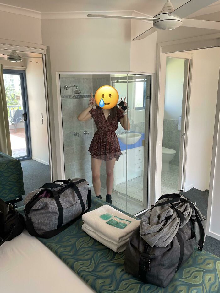 Unusual home interior with a glass shower visible in the bedroom, highlighting an odd design choice.