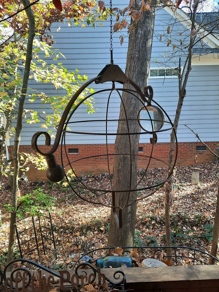 What Is This Cast-Iron Contraption With Cage And Magnifying Glass?