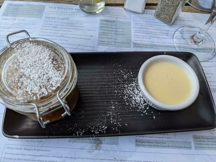 Apple Crumble In A Jam Jar With Powdered Sugar On The Lid So When You Open It You Get Covered In Sugar