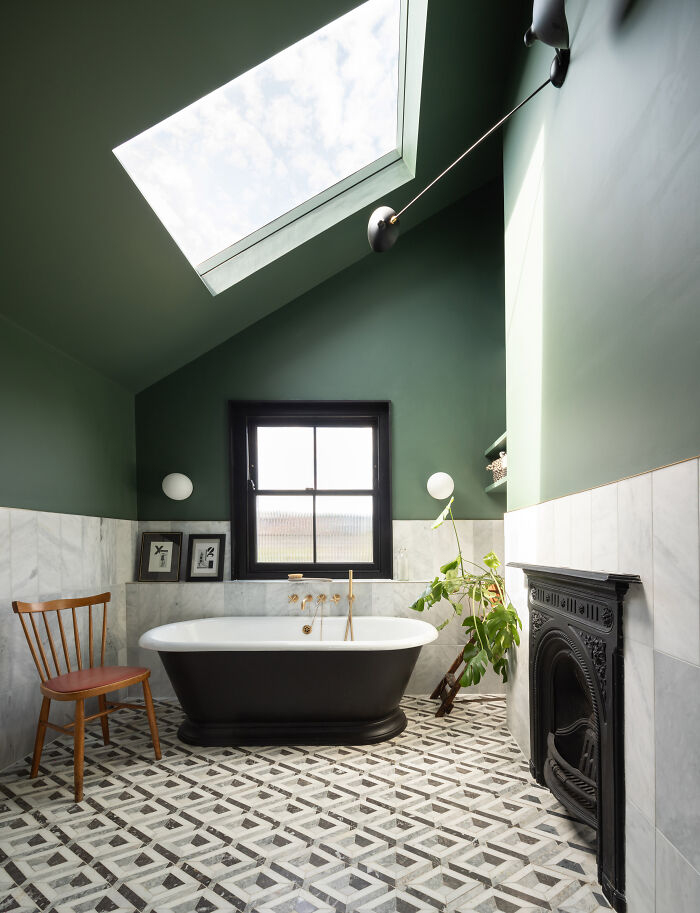 Freestanding Tub Under A Skylight In The Bathroom Of A Renovated Victorian House, Hackney, East London, UK