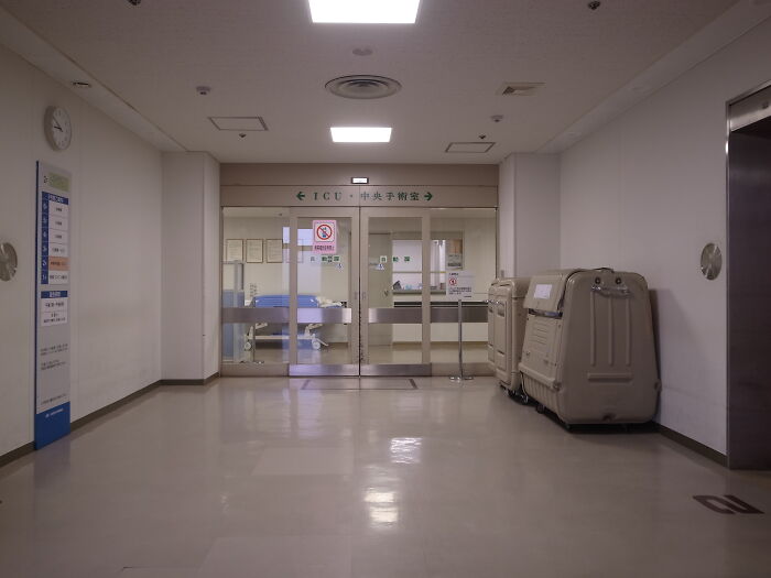 Empty hospital corridor leading to ICU entrance, illustrating a setting where lawyers in this online group share moments they knew people messed up.