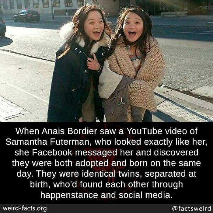 Two women smiling on a city street, illustrating a weird fact about identical twins reunited through social media.