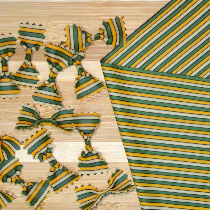 Striped pasta designs shaped like bow ties, showcasing unique pasta creations by a chef trending on social media.