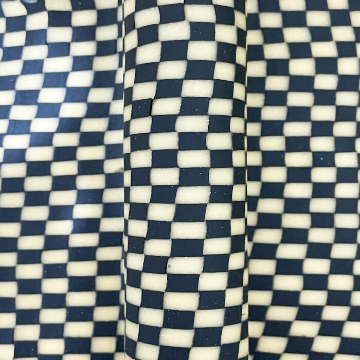 Checkerboard patterned pasta design rolled out flat, showcasing unique pasta designs by the chef in a viral social media trend.