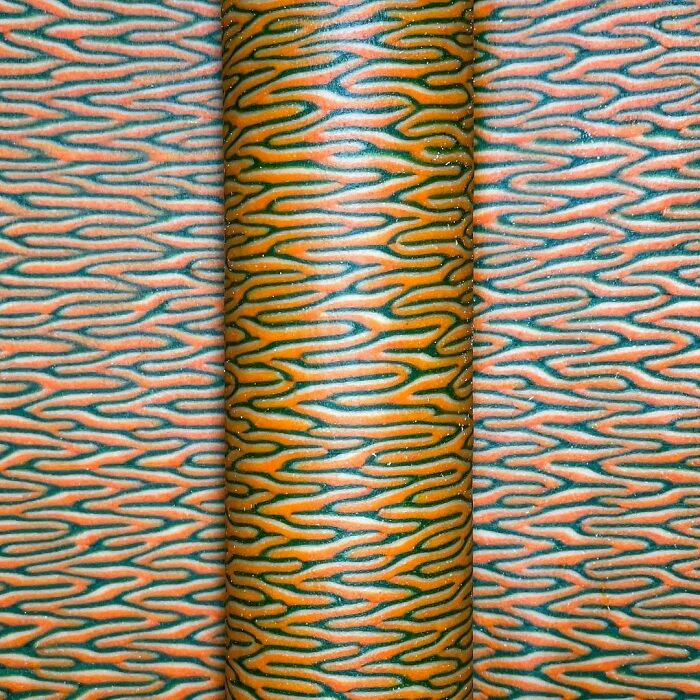 Close-up of unique pasta designs featuring intricate orange and green patterns created by a viral chef on social media.