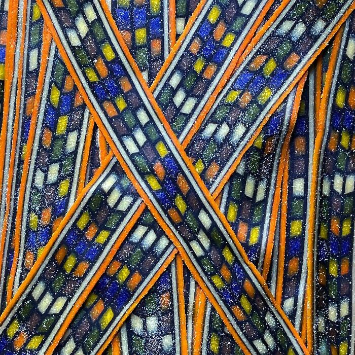 Colorful pasta strands with unique mosaic-like designs created by a chef showcasing unique pasta designs.