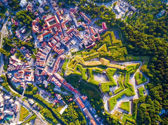 Aerial view of Poland showing a modern and diverse cityscape with historic architecture and green spaces.