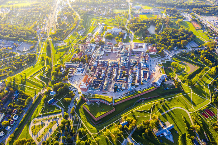 Aerial view of a historic city in Poland showcasing its modern, interesting, and diverse urban landscape.