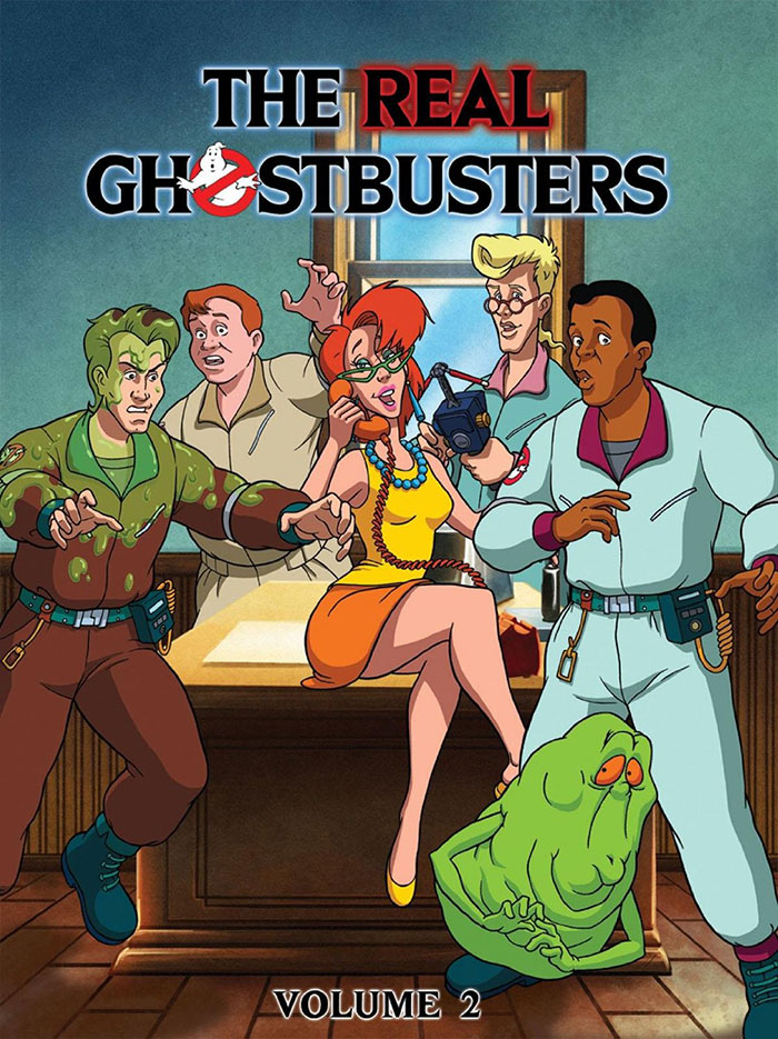 '80s cartoon characters from The Real Ghostbusters standing together in a room with equipment.