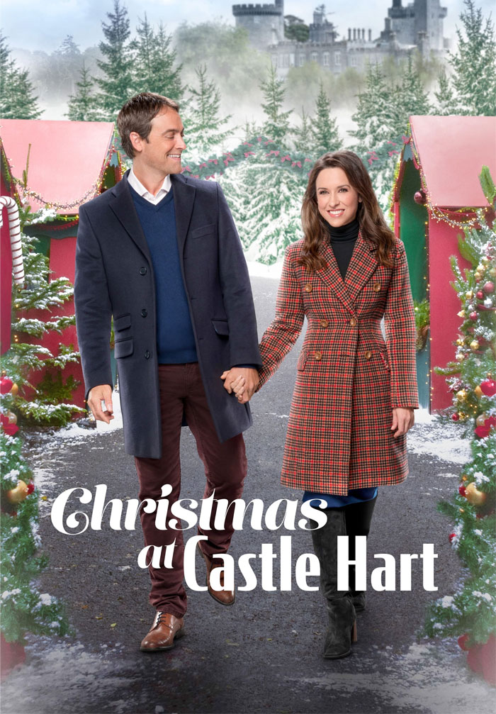 A cozy couple walking hand in hand in a festive winter scene, promoting a Christmas movie.
