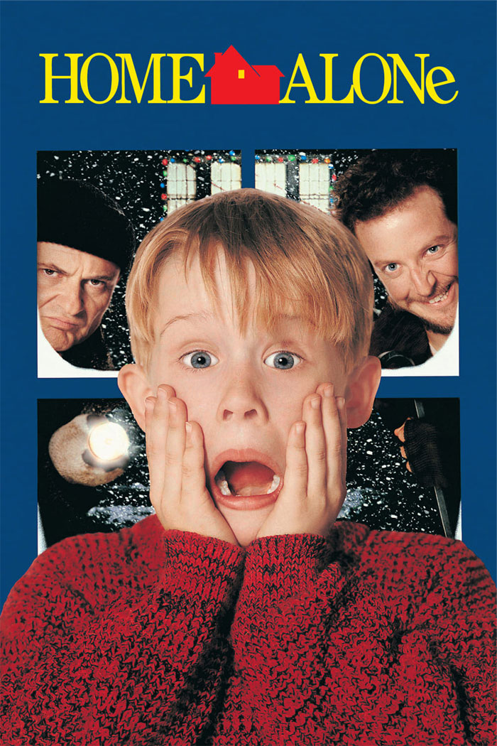 A child in a red sweater from the iconic Christmas movie cover with two burglars in the background.