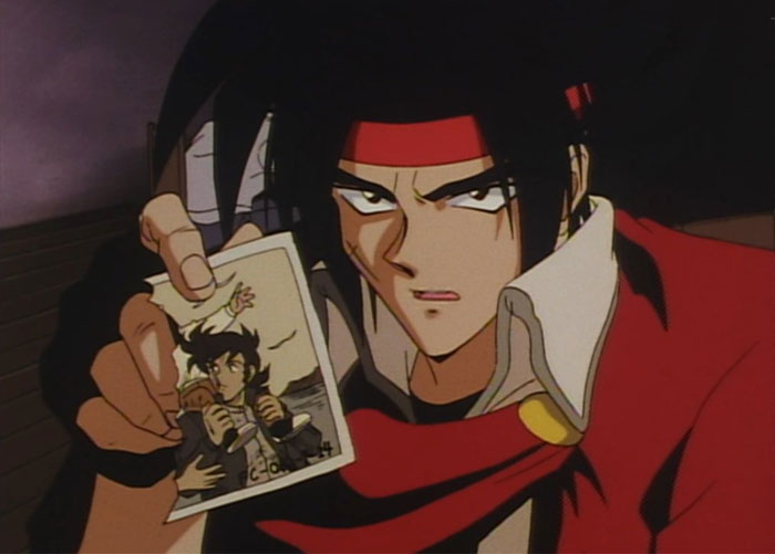 Domon holding a photo