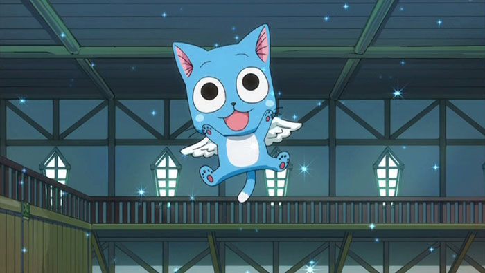 Cute animated character with blue fur and wings, floating joyfully in a brightly lit room.
