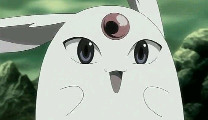 Cute animated character with large ears and a single eye on its forehead, set against a greenish background.