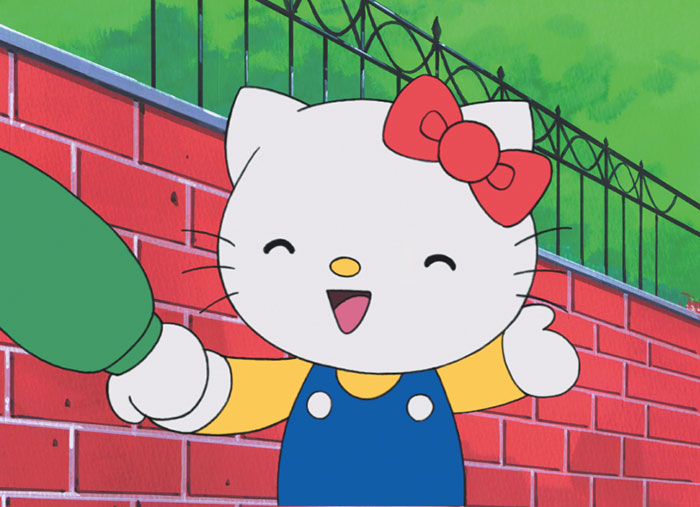 Cute animated character with a red bow and blue outfit, smiling in front of a red brick wall with greenery above.