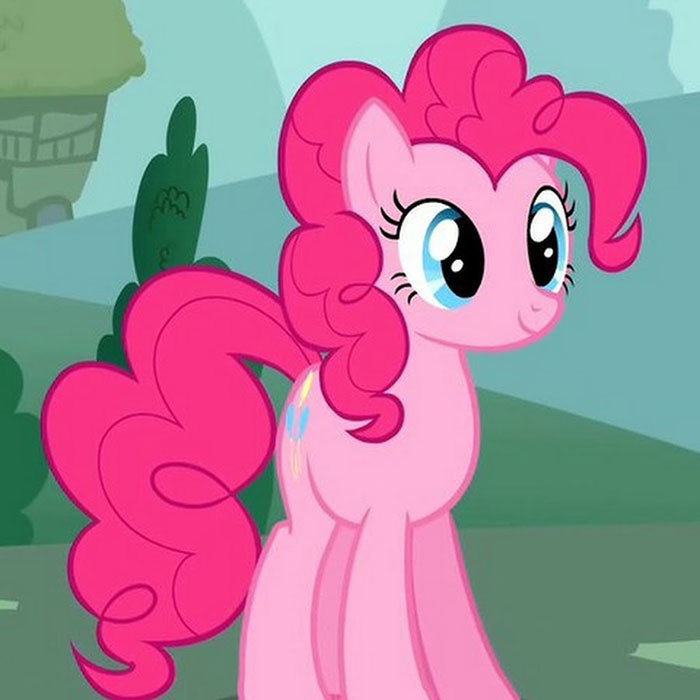 Pink pony with curly hair standing in a green landscape, representing cute animated characters.