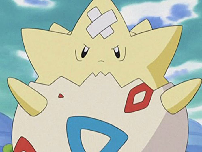 Cute animated character with a yellow star shape and bandage on its head, standing against a blue sky and clouds.