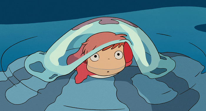 Cute animated character peeking out from under a wave, with red hair and big eyes in an ocean setting.