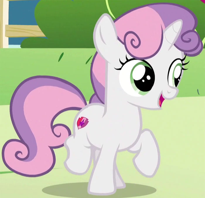 Cute animated character with purple mane and tail, bright eyes, and a heart symbol on its side in a playful pose.