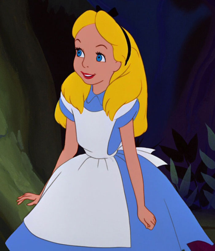 Cute animated character in a blue dress and white apron sitting and smiling.