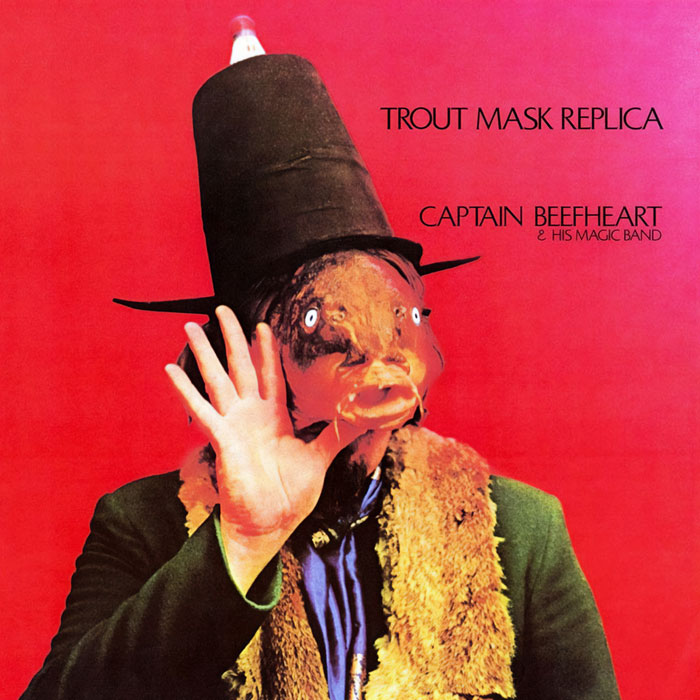Surreal album cover with a top-hatted figure wearing a fish head mask against a red background, from greatest album covers series.