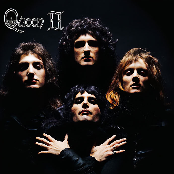 Iconic album cover featuring four silhouetted faces from "Queen II," known for its striking composition and lighting.