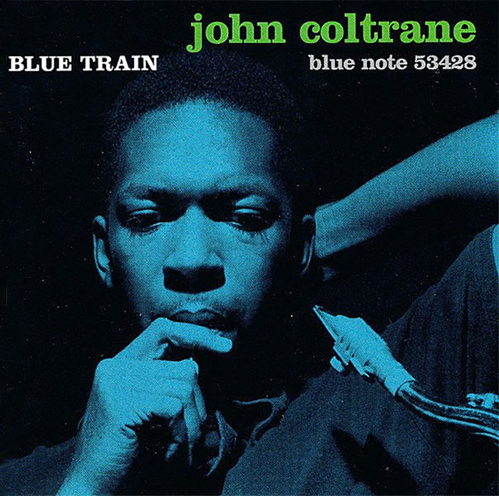 Iconic album cover featuring a contemplative musician with a saxophone, in blue tones.