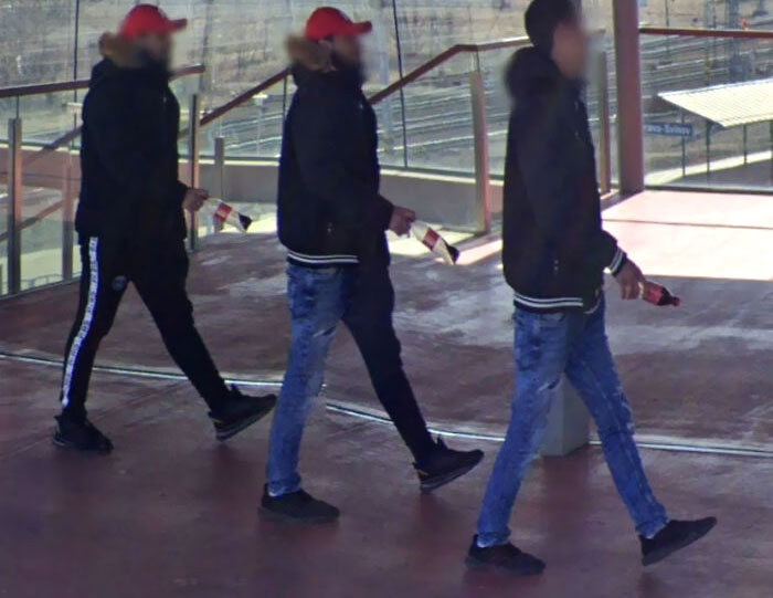 Two Red Hats, Two Same Jackets, Two Same Jeans. All Have Coke And The Same Pose