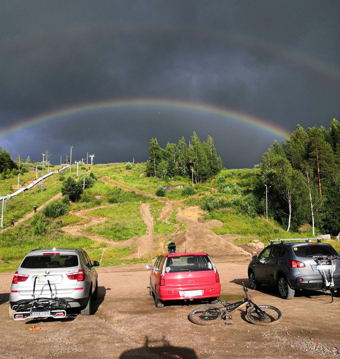 A Double Rainbow Perfectly Over A Hill