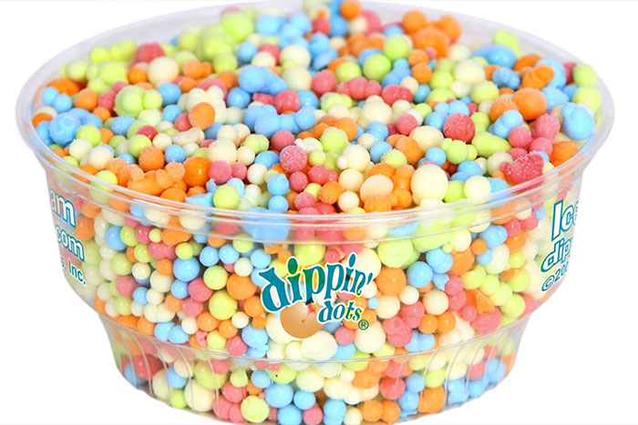 Colorful Dippin' Dots in a clear container, a nostalgic 90s food favorite.