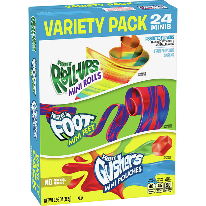 Variety pack of nostalgic 90s foods featuring Fruit Roll-Ups, Fruit by the Foot, and Gushers.