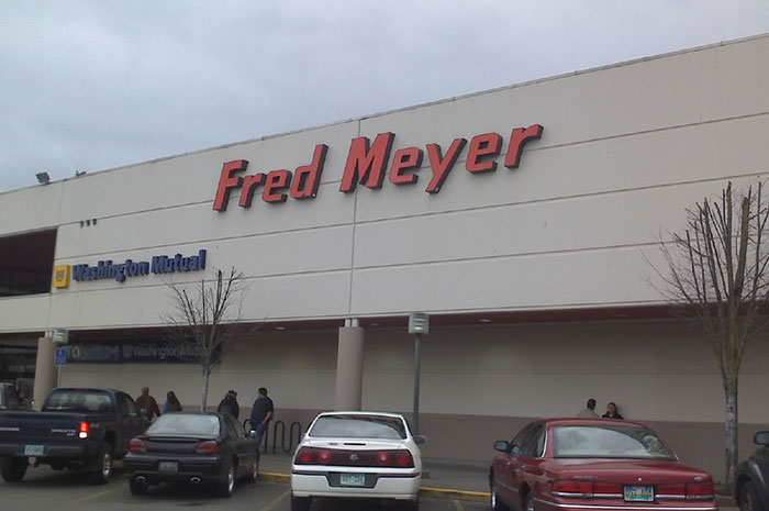Fred Meyer store exterior with parked cars, illustrating workplace scenes for dark secrets about jobs revealed by employees.