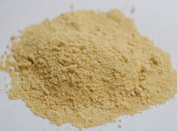 Close-up of a heap of light brown powder on a white surface illustrating dark secrets about jobs not known to common people.