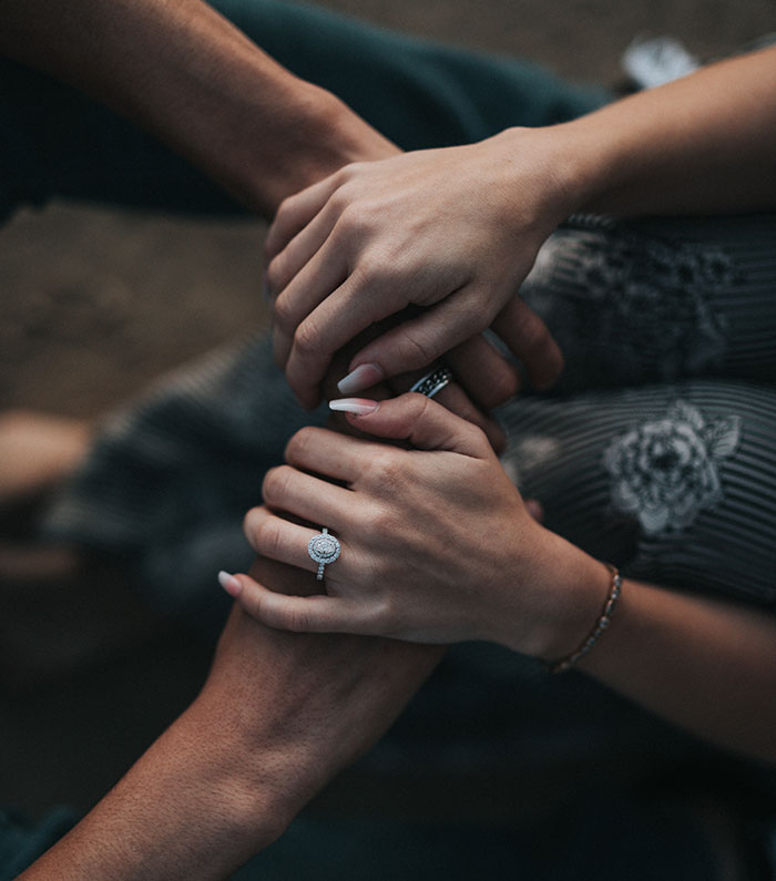 Man and woman holding each others hands