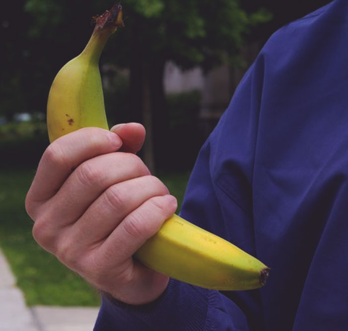 Person holding a banana