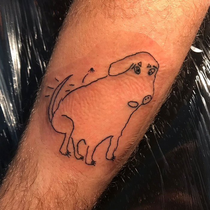 Tattoo of a simplistic dog drawing on a forearm by a popular tattoo artist known for unique designs.